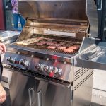 Chef Phillip Dell grilling some amazing hamburgers on a Bonfire Grill