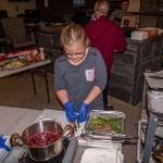 Tatem Helping Chef Phillip Dell at the Ultimate Holiday Grilling Class